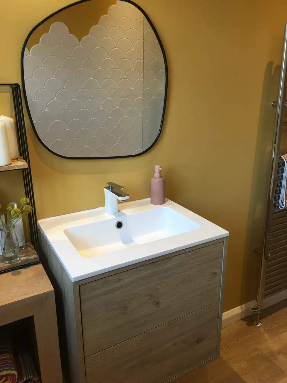 Wall-hung timber-effect vanity with curved black mirror